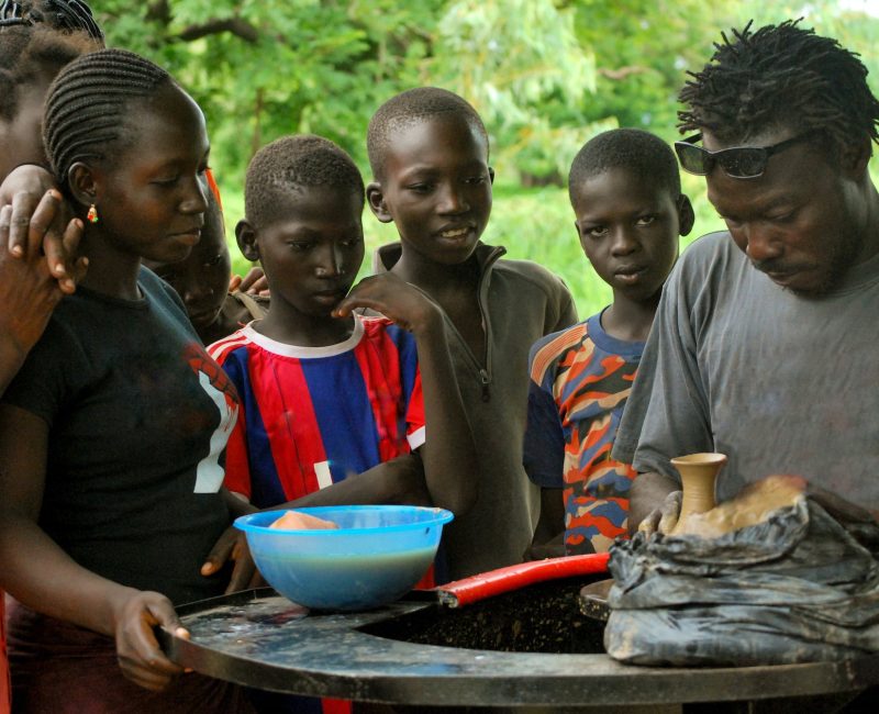 young-african-streeft-children-taking-a-pottery-course-reeducation-volunteering.jpg